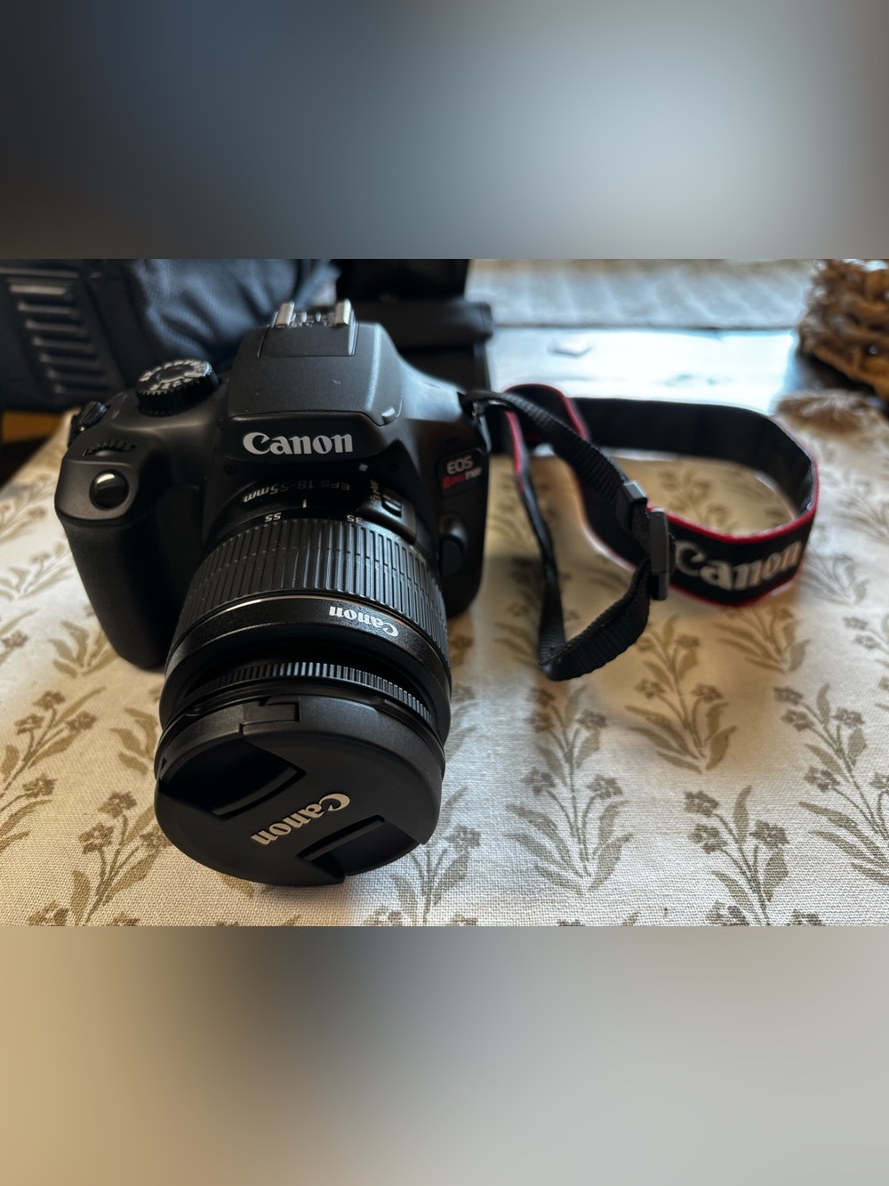 Canon DSLR Camera with Black Body and Red-Trim Strap